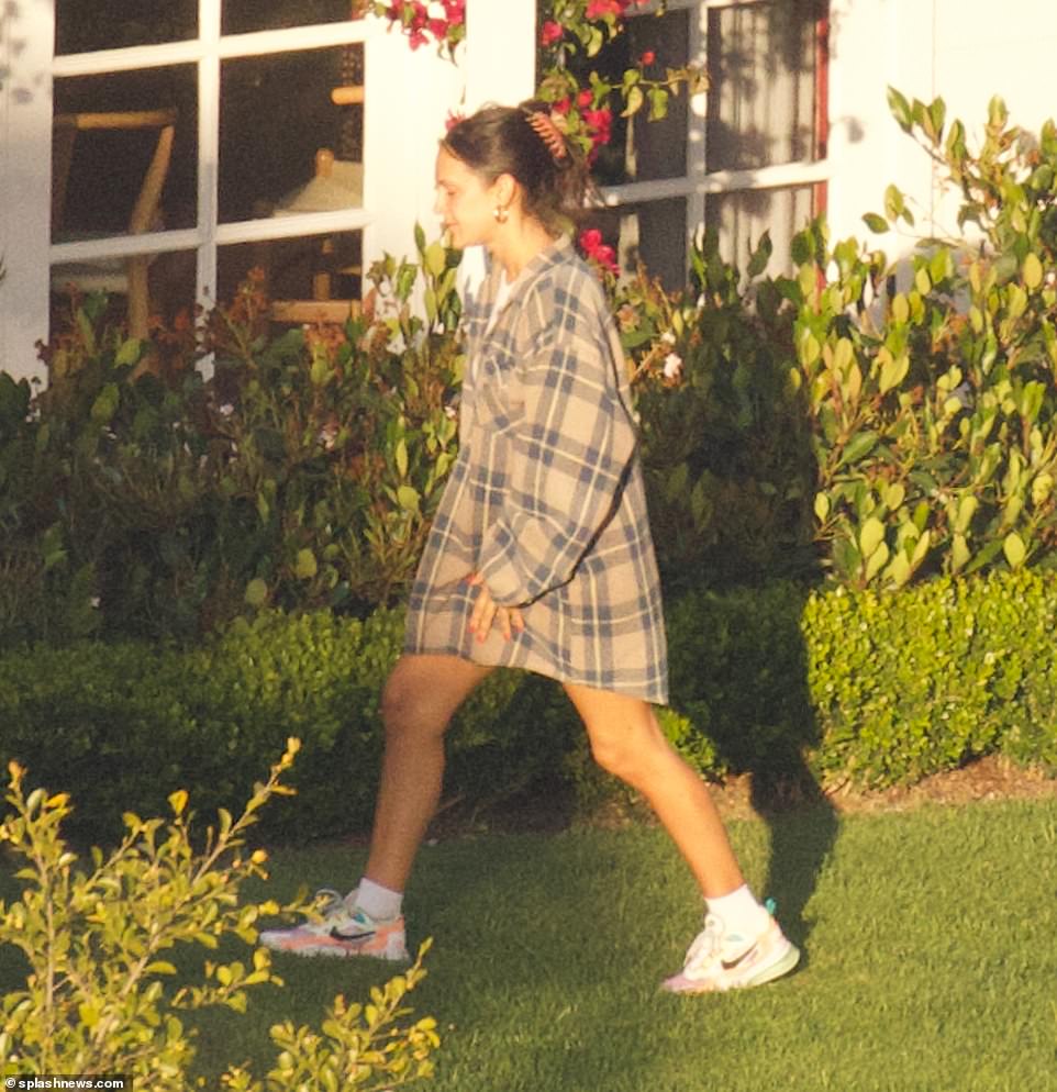 Showing her style: The Call Me By Your Name actor's older sister and star of The Sex Lives Of College Girls, Pauline, could be seen wearing an oversized grey and blue flannel along with colorful Nike sneakers