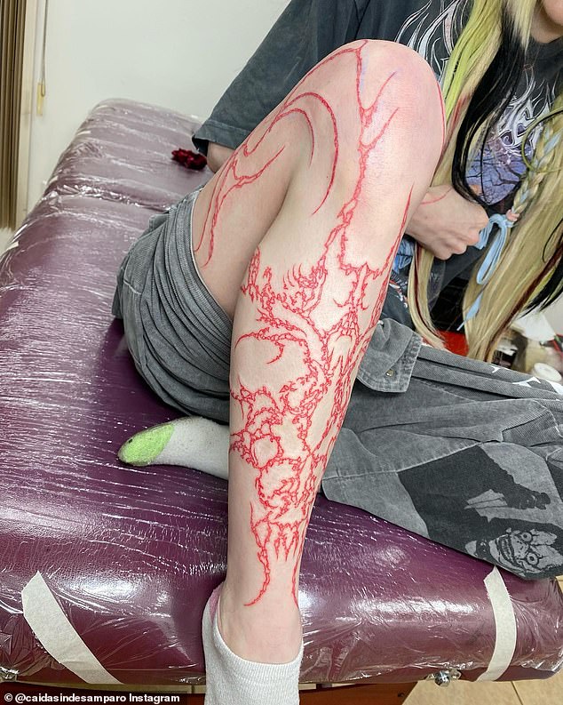 New ink: Grimes, 35, revealed she had gotten a massive tattoo on her leg in Instagram posts from Thursday