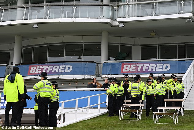 police officers prepare for a busy day at the Epsom Derby on Saturday
