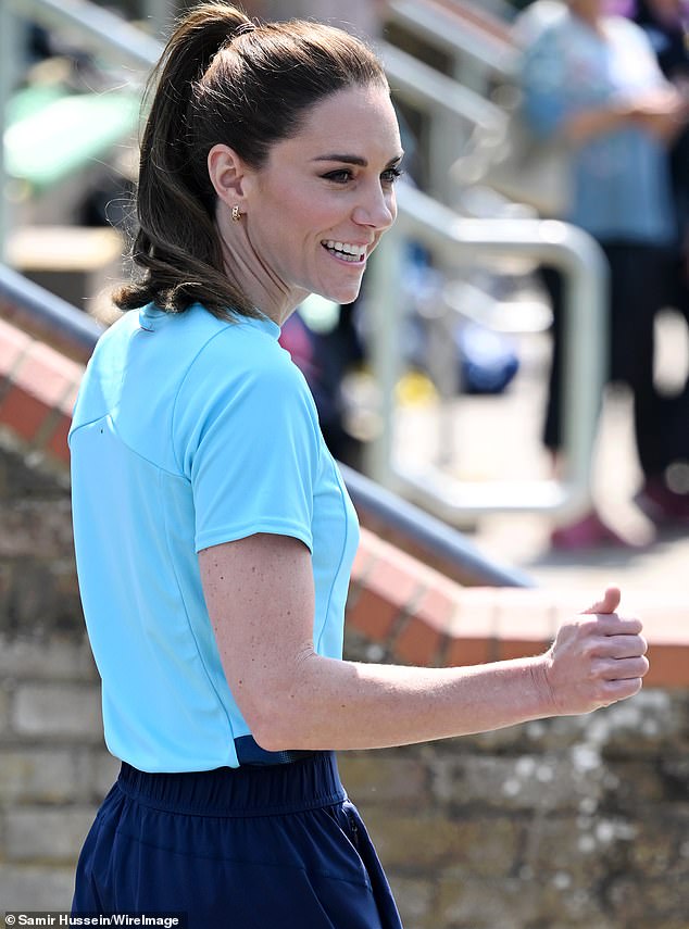 Sporty Kate, 41, opted for blue tones with an aqua rugby t-shirt and navy blue tracksuit bottoms and had her hair pulled into a tight ponytail