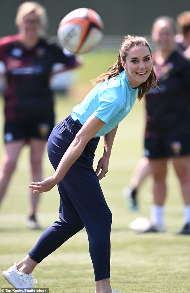 Kate's brilliant white trainers soon got covered in grass as she got stuck into rugby training with the players