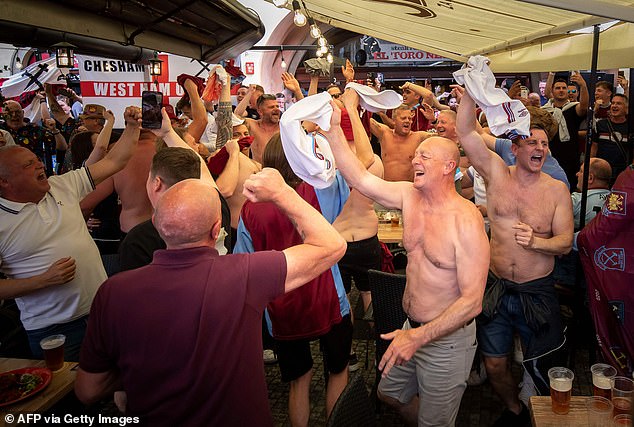 West Ham fans cheer for their team at the Old Town Square ahead of the UEFA Europa Conference League 2022/23 final match between ACF Fiorentina and West Ham United FC in Prague, Czech Republic on June 7