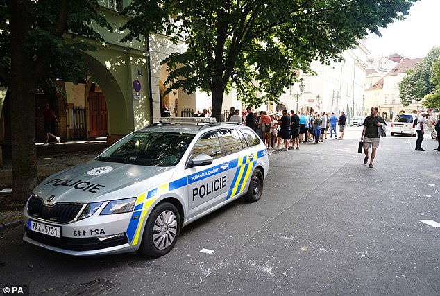 Pictured: A police car is seen in Prague near to the bar where Italian ultras attacked West Ham fans ahead of the final