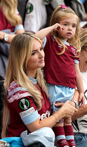 Sadie, who is the spitting image of her mother, looked adorable in a West Ham jersey