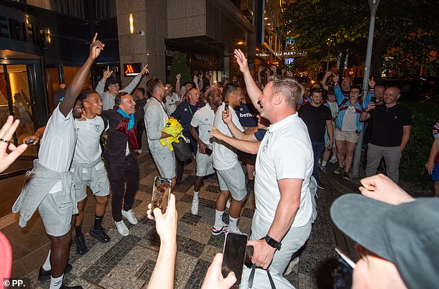 Despite the early hour, the players looked in no mood to end their celebrations as they walked in the street, hugged and signed autographs for fans
