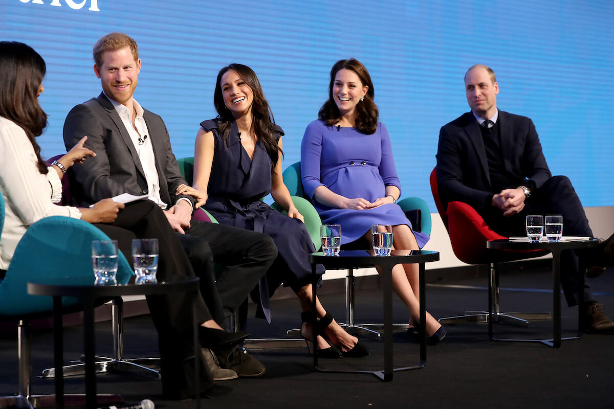 Meghan Markle, who had a 'totally different' reaction to 2018 Royal Foundation Forum question about disagreements, sits onstage with Prince Harry, Kate Middleton, and Prince William