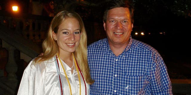 Natalee Halloway in white graduation cap, father to her left