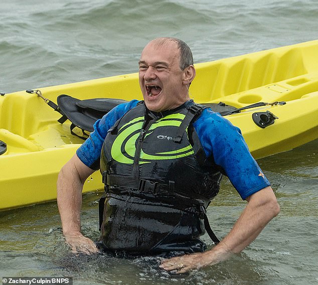 Luckily, the Lib Dem leader saw the funny side and laughed off the incident as he clambered to his feet in the sea and began splashing Mr Bararinde