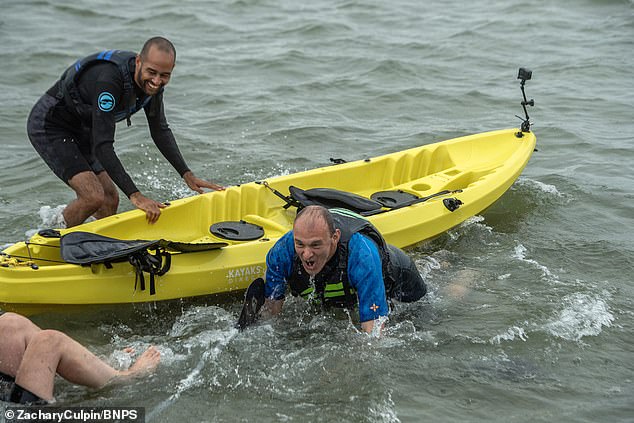 Sir Ed (centre) took to the water in a kayak at Sandbanks at the start of the Liberal Democrat conference season in Dorset
