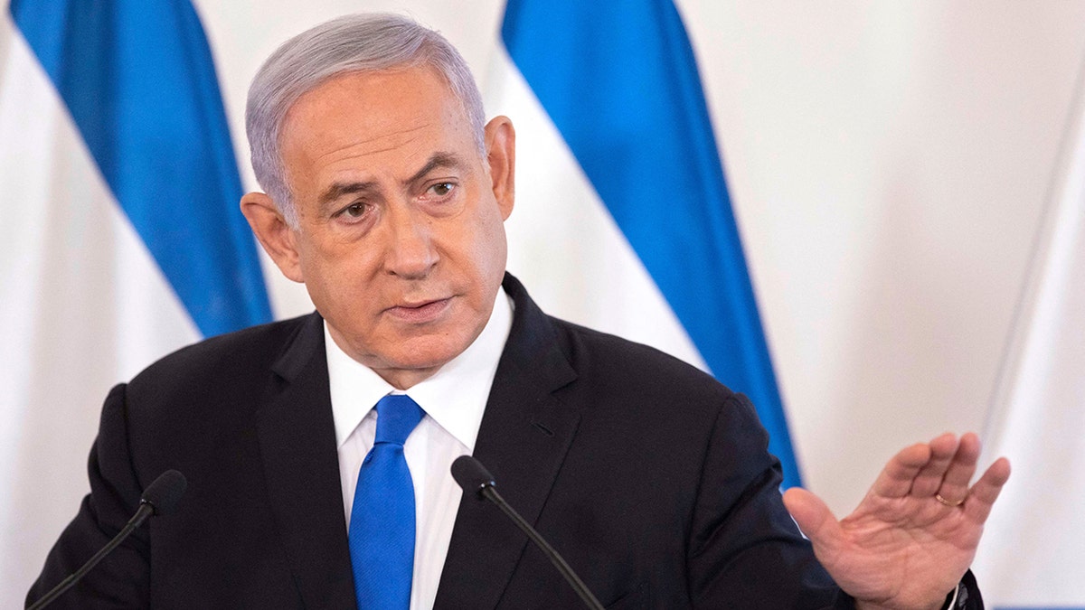 Netanyahu speaking at podium