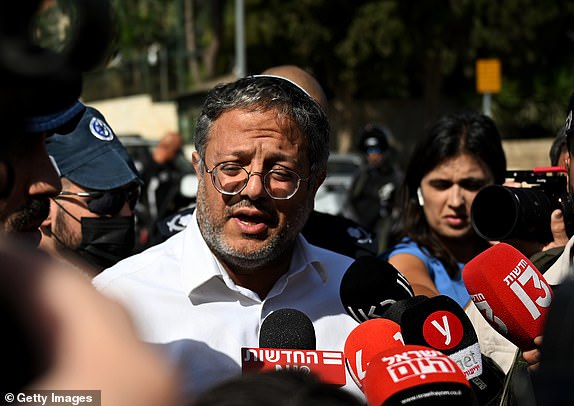 JERUSALEM, ISRAEL - OCTOBER 30: Israeli National Security Minister Itamar Ben-Gvir (C) speaks to media near the scene of a reported stabbing attack on October 30, 2023 in Jerusalem, Israel. An Israeli border police officer was injured in a knife attack before the assailant was confronted by police. (Photo by Alexi J. Rosenfeld/Getty Images)
