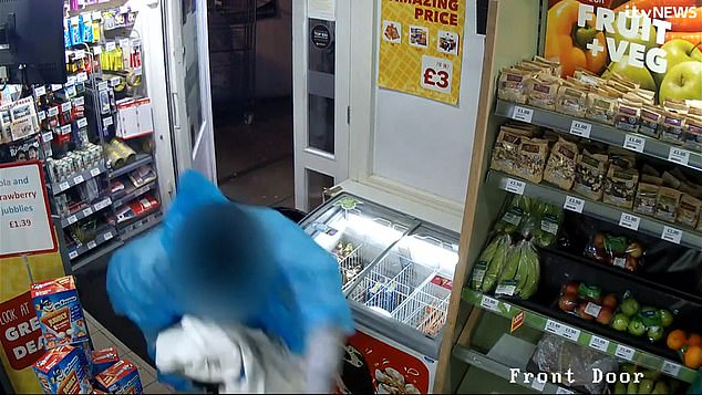 Shocking footage shows two balaclava-clad men running into a village shop in Derbyshire