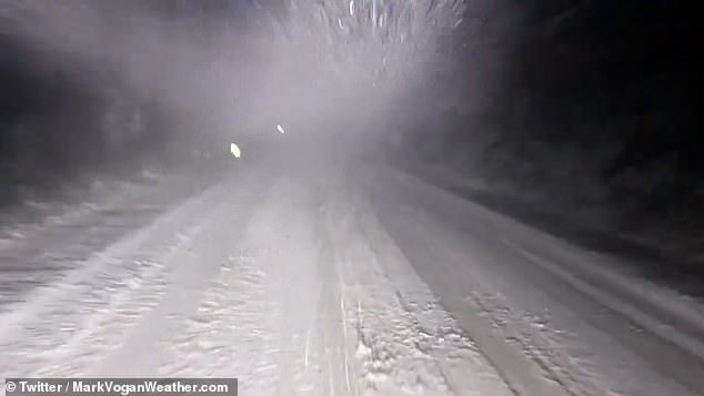 SLOCHD SUMMIT, SCOTLAND: Footage shows a commuter driving in blizzards early this morning