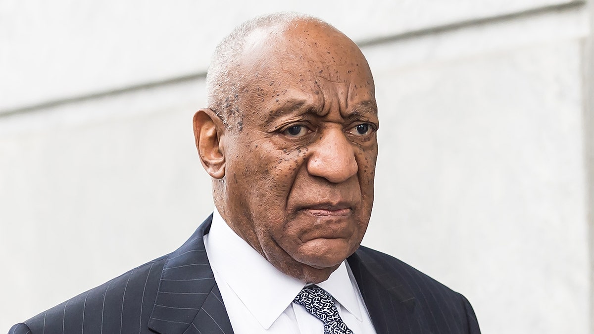 Bill Cosby leaves courthouse wearing a pinstripe suite