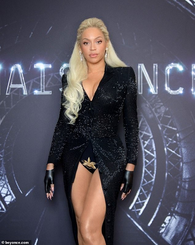 Beneath Beyonce's sparkly frock was a busty black bodysuit with a gold flower embroidered just below her abdomen