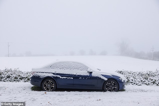Snow covers a car in the Kent Downs on Saturday as temperatures plummet to -10c in some isolated places