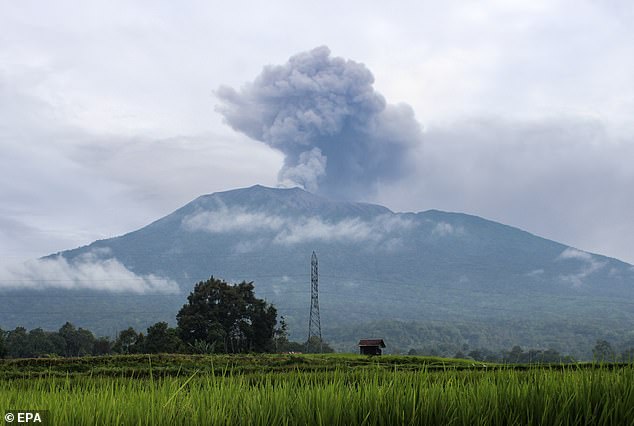 Mount Marapi spews volcanic materials during an eruption seen from Batu Palano village in Agam, West Sumatra, Indonesia, 4 December 2023.